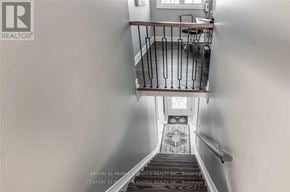Oakville (Cp College Park) apartment for rent - A staircase with a metal railing and a tiled floor.