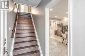 Oakville (Cp College Park) apartment for rent - A staircase with wooden steps leads to a brightly lit room.