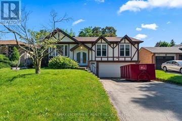 Oakville (Wo West) apartment for rent - A house with a red dumpster in front of it.