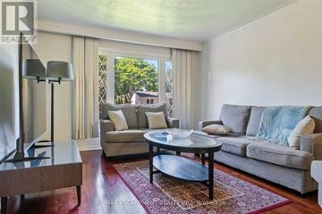 Oakville (Wo West) apartment for rent - A living room with a grey couch and a coffee table.