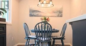 Cambridge apartment for rent - A dining room with a table set for four.