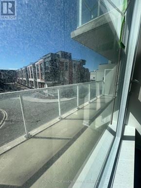 Richmond Hill (Crosby) condo for rent - A view from a window looking out at a construction site.