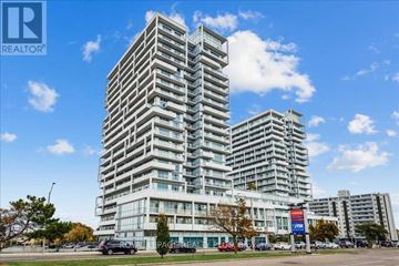 Oakville (Co Central) condo for rent - A tall residential building with multiple floors and balconies is under a clear blue sky.