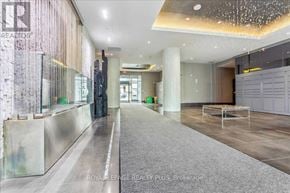 Oakville (Co Central) condo for rent - A hallway with a glass wall and a carpeted floor.