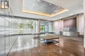 Oakville (Co Central) condo for rent - A spacious room with a glass wall and a wooden floor.