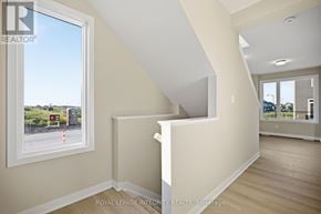 Ottawa townhouse for rent - A room with a window showing a parking lot outside.