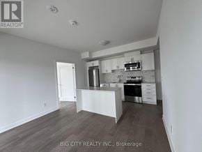 Newmarket (Huron Heights-Leslie Valley) condo for rent - A white kitchen with a stove top oven and a microwave above it.