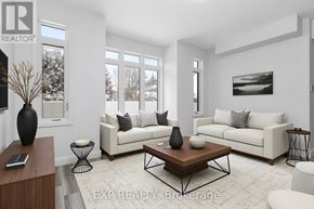 Ottawa multi-family for rent - A living room with a white couch, a coffee table, and a large window.