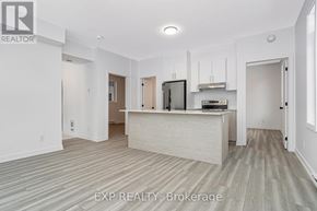 Ottawa multi-family for rent - A realtor brokerage office with a white reception desk and a television on the wall.