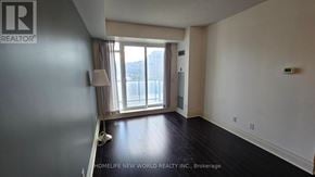 Markham (Unionville) condo for rent - A room with a window and a lamp on the side table.