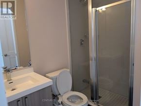 Vaughan (Concord) townhouse for rent - A bathroom with a toilet, sink, and shower.