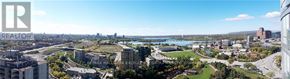 Ottawa condo for rent - A cityscape with a river running through it.
