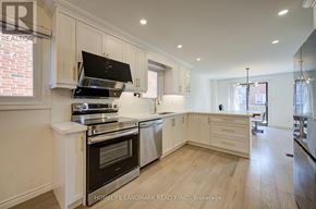 Toronto (Agincourt North) apartment for rent - A modern kitchen with a stove top oven and a range hood.