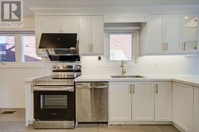 Toronto (Agincourt North) apartment for rent - A kitchen with white cabinets and a stainless steel dishwasher.