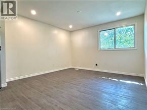 Kitchener apartment for rent - A room with a window and a wooden floor.