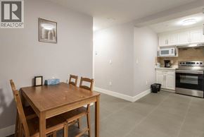 Vancouver apartment for rent - A dining room with a wooden table and chairs.