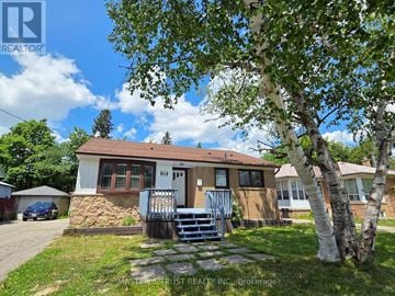 Richmond Hill (Crosby) apartment for rent - A house with a tree in front of it.
