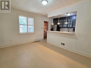 Richmond Hill (Crosby) apartment for rent - A room with a window and a door leading to another room.