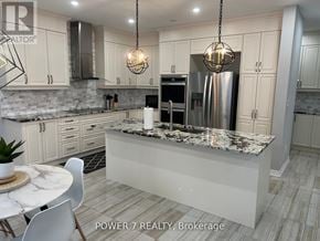 East Gwillimbury (Holland Landing) apartment for rent - A modern kitchen with granite countertops and stainless steel appliances.