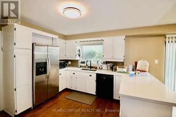 Aurora (Aurora Highlands) apartment for rent - A kitchen with white cabinets and a refrigerator.