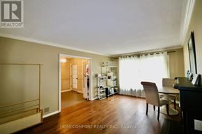 Aurora (Aurora Highlands) apartment for rent - A room with a chair and a table in it.