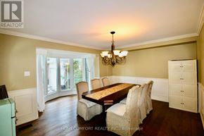 Aurora (Aurora Highlands) apartment for rent - A dining room with a wooden table and chairs.