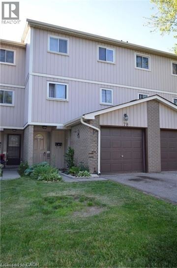 Kitchener townhouse for rent - A two-story residential building with a garage.