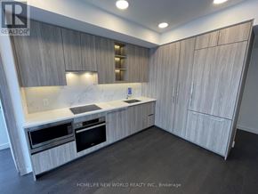 Toronto (Bayview Village) condo for rent - A modern kitchen with wooden cabinets and stainless steel appliances.