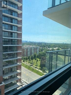 Toronto (Humber Heights) condo for rent - A view from a high-rise building looking out over a cityscape.