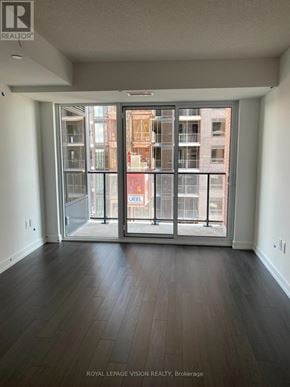 Toronto (Humber Heights) condo for rent - A room with a sliding glass door leading to a balcony.