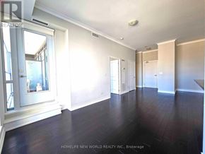 Mississauga (City Centre) condo for rent - A spacious room with wooden floors and white walls.