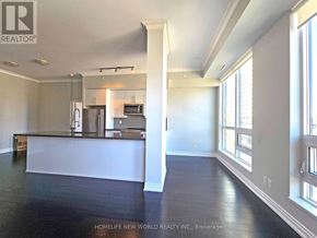 Mississauga (City Centre) condo for rent - A spacious kitchen with white countertops and a refrigerator.