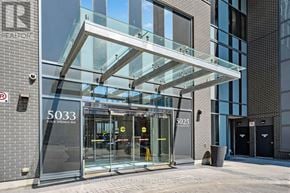 Mississauga (Hurontario) condo for rent - The image shows a modern building entrance with glass doors and a glass roof structure above.