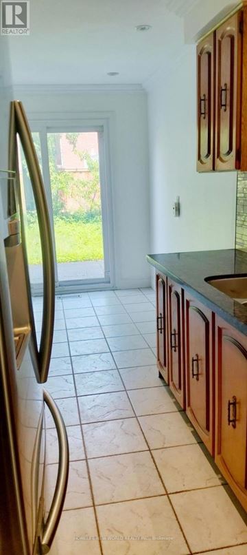 Mississauga (Creditview) apartment for rent - A kitchen with a refrigerator and cabinets.