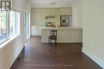 Toronto (Newtonbrook East) townhouse for rent - A kitchen with a counter and a chair.