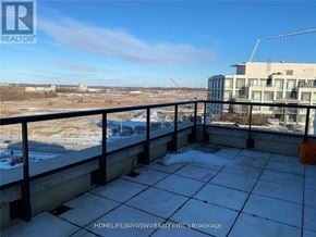 Markham (Unionville) condo for rent - A balcony with a view of a construction site and buildings.