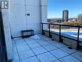 Markham (Unionville) condo for rent - A balcony with a bench and a view of the city.