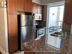 Markham (Unionville) condo for rent - A kitchen with granite countertops and stainless steel appliances.