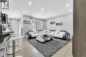 Stratford apartment for rent - A modern living room with a white sofa set and a grey rug.