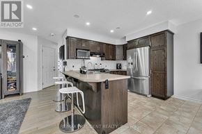 Stratford apartment for rent - A modern kitchen with a center island and stainless steel appliances.