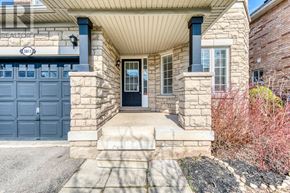 Burlington (Orchard) apartment for rent - A house with a blue garage door and a stone wall.