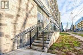 Waterloo condo for rent - A building with a staircase leading to the entrance.