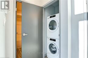 Waterloo condo for rent - A washing machine is in a small room.
