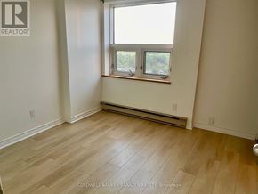 Ottawa condo for rent - A room with a window and a radiator on the wall.