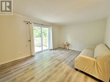 London East (East C) townhouse for rent - A living room with a couch and a small table.