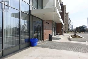 Toronto (Henry Farm) condo for rent - A modern building with glass windows and a sign that reads "REALTOR".