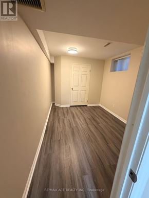 Toronto (Rouge) apartment for rent - A room with a white door and a window with a white wall.
