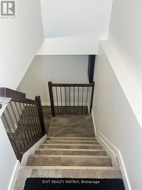 Ottawa apartment for rent - A staircase with a black mat on the floor.