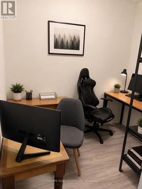 Waterloo condo for rent - A black chair sits in front of a desk with a computer monitor.