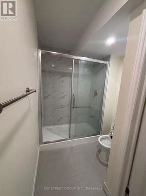 Markham (Greensborough) apartment for rent - A bathroom with a glass shower door and a toilet.